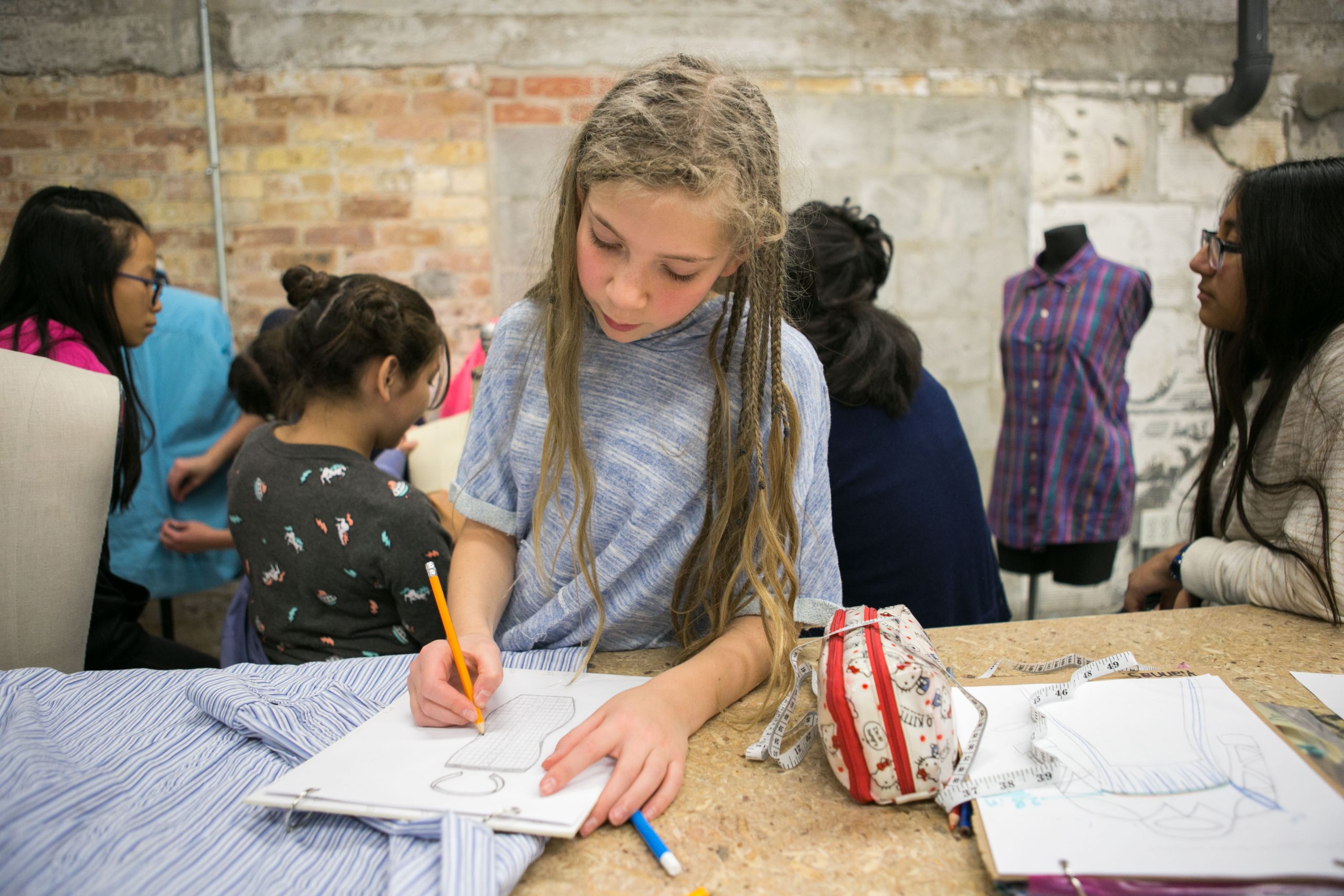 Young artists having fun in Marwen class Sew Much Fun.