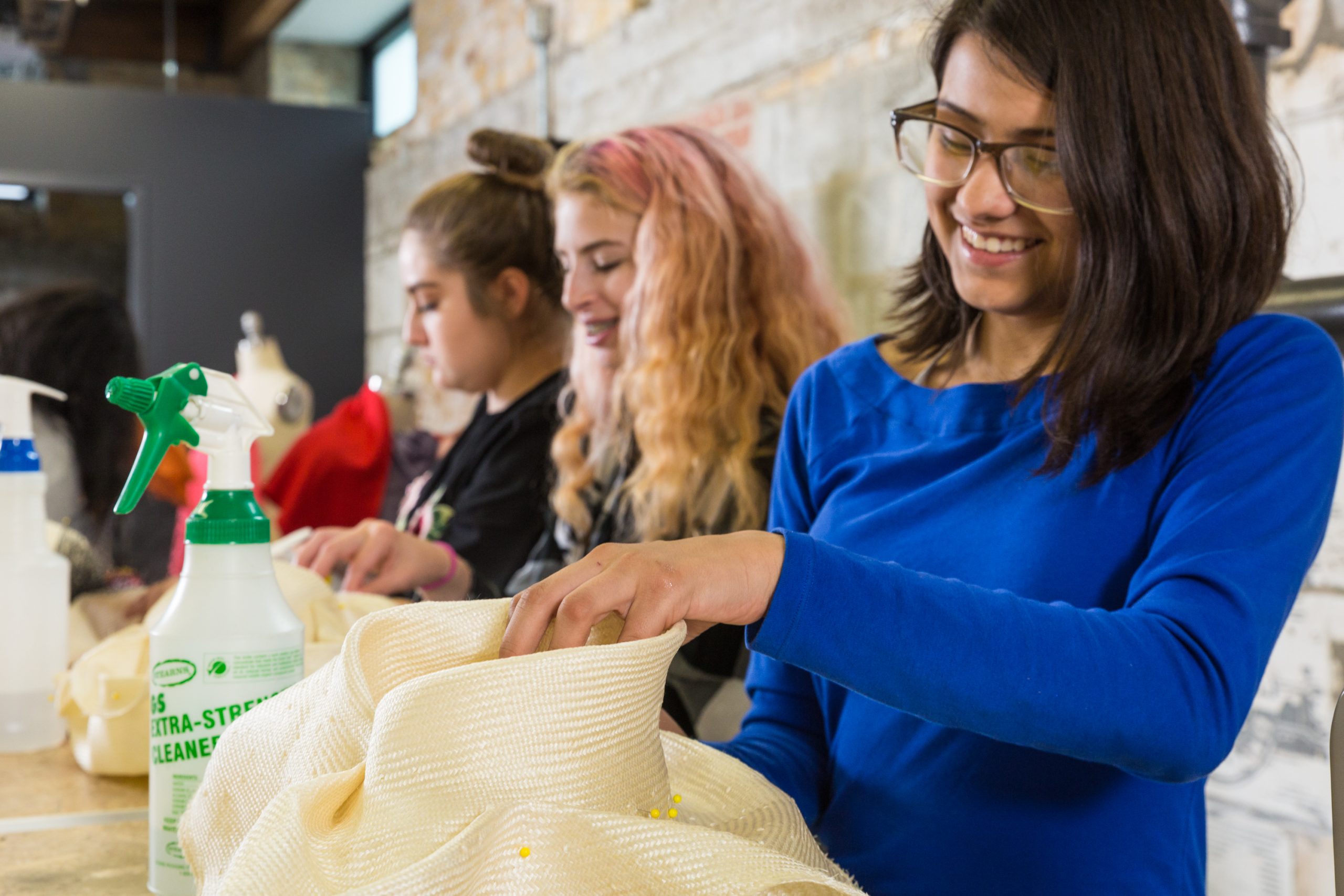 ForTheMedia_170905_MarwenAnnualReport_FashionStudio-34 - Marwen Smiling young artists work on fiber arts in the Marwen fashion studio.
