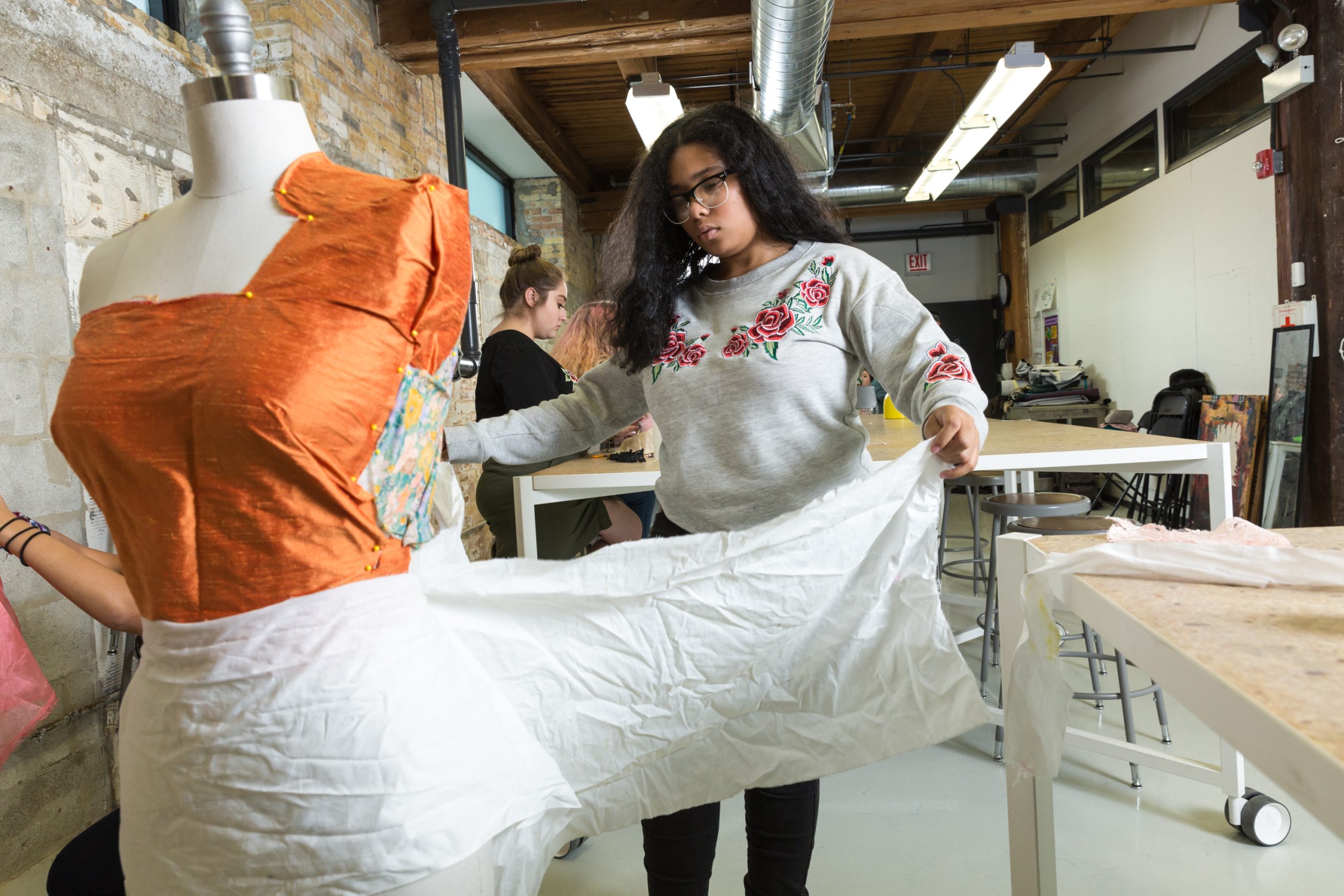 ForTheMedia_170905_MarwenAnnualReport_FashionStudio-96 - Marwen A young artist works on draping fabric in Marwen's fashion studio.