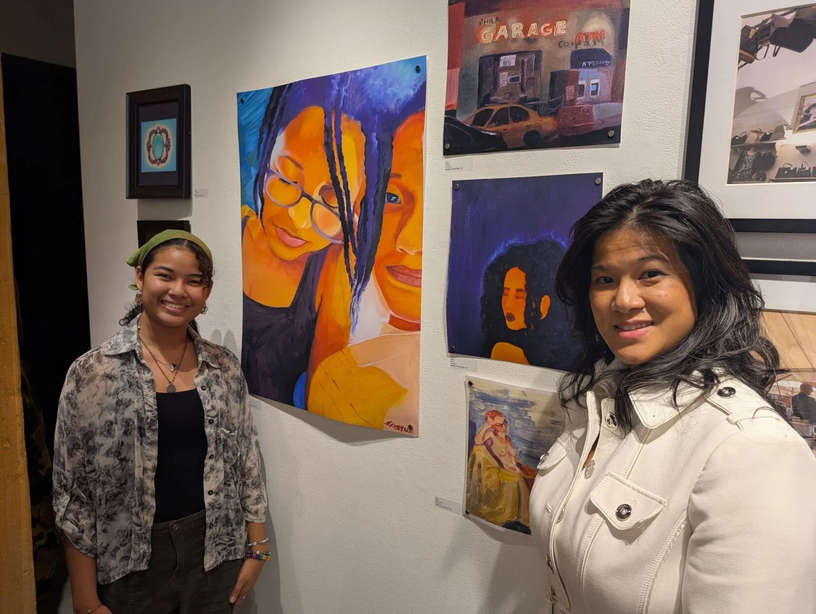 Via and Tessa McEwen pose with Via's work at the annual Marwen Art Fair on Oct. 17, 2025. Photo by Morley Musick